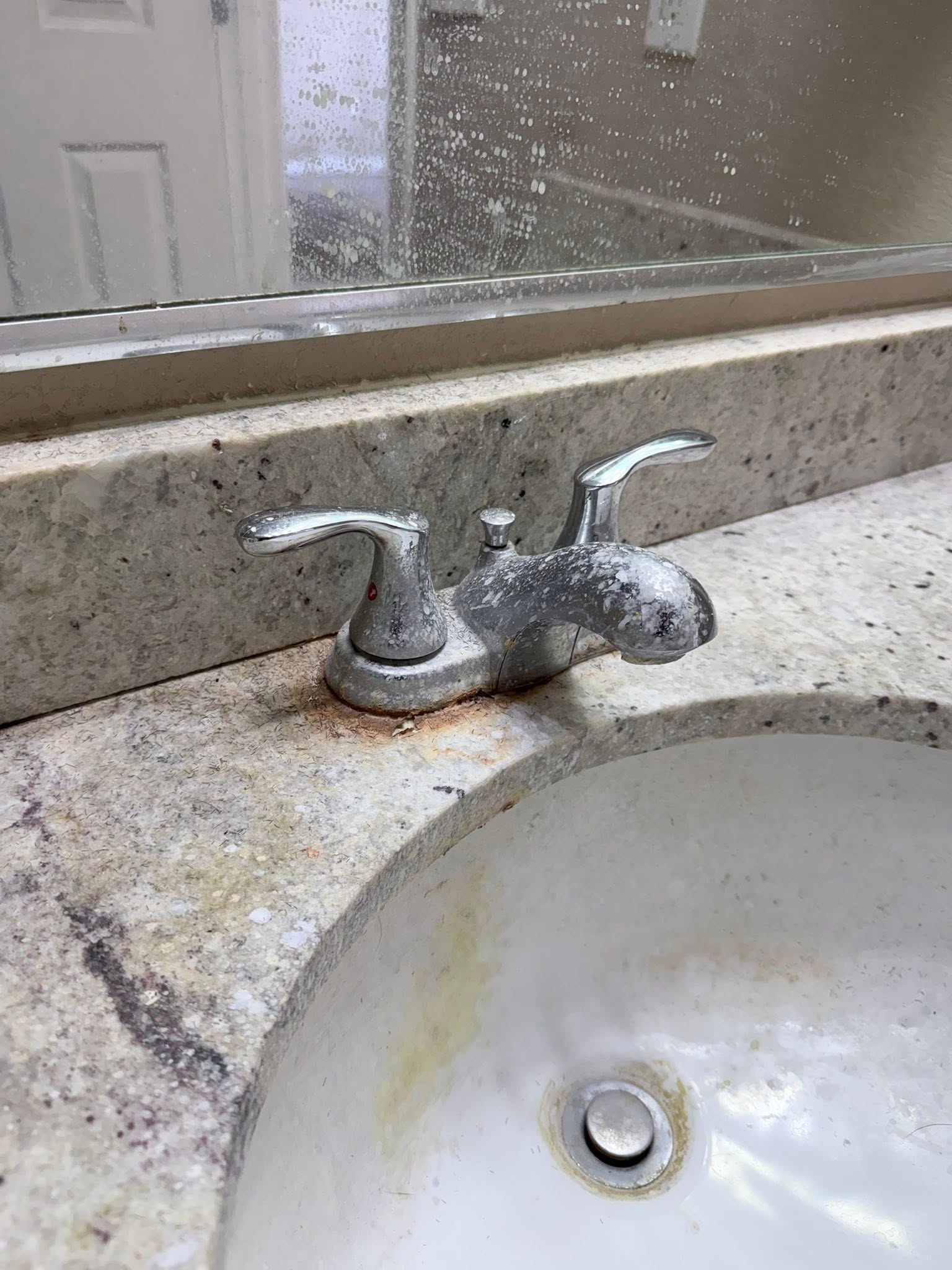 Dirty sink with grimy faucet before cleaning